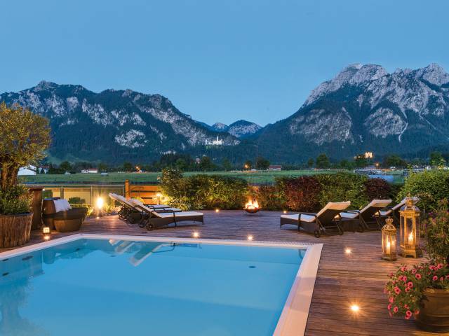 Outdoor pool with a view of Neuschwanstein Castle